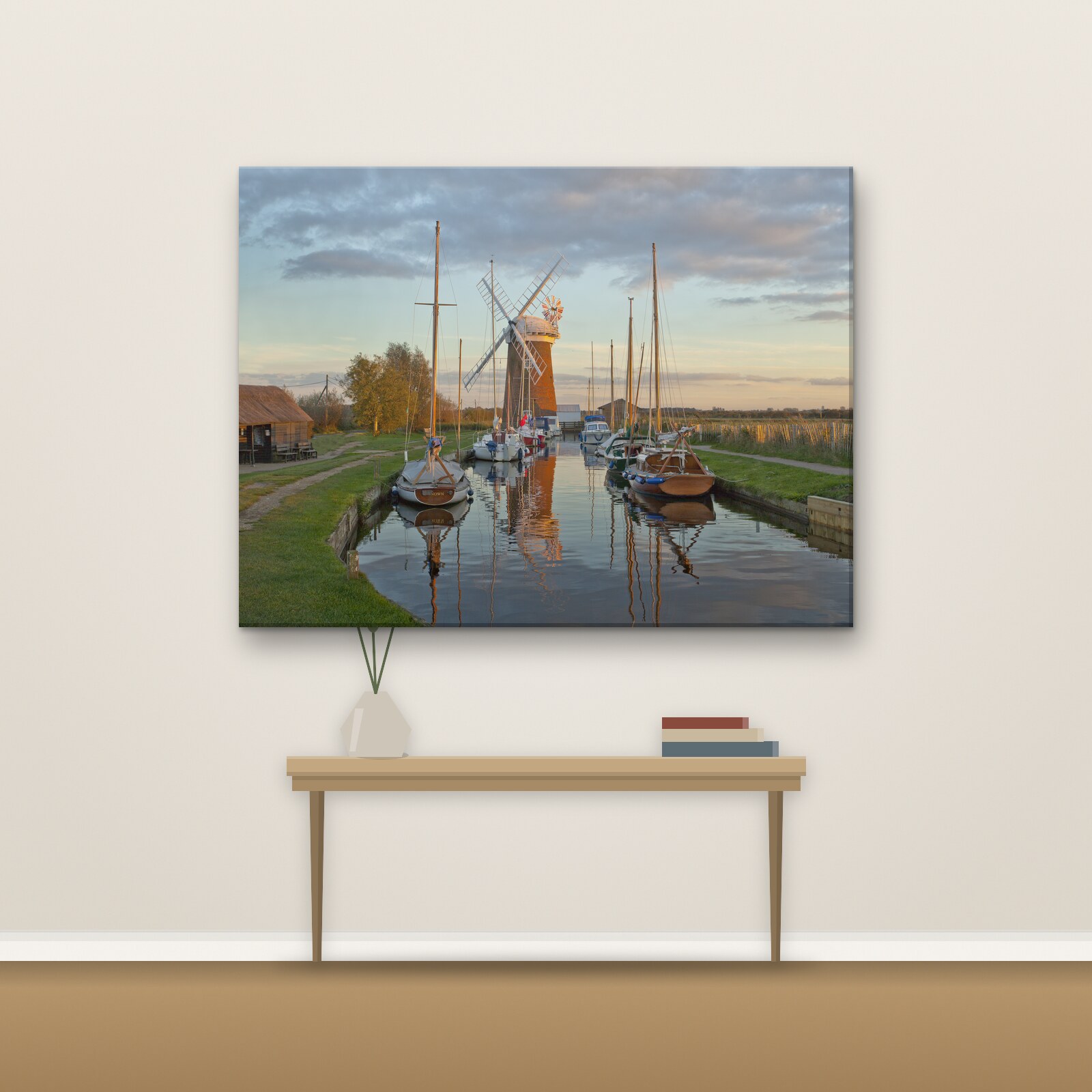Example photo on a landscape canvas hanging on a living-room wall above a console table