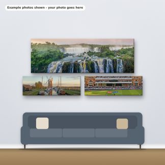 Example photos on three panoramic canvases hanging above a sofa